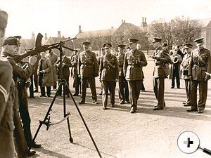 King watches training