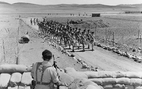 The Drums leading a platoon into camp after training Mukerias