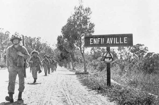 Men of 169th Brigade passing through Enfidaville.